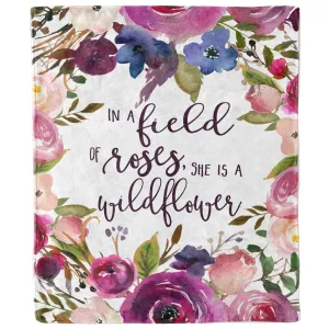 In a Field of Roses She Is a Wildflower Blanket