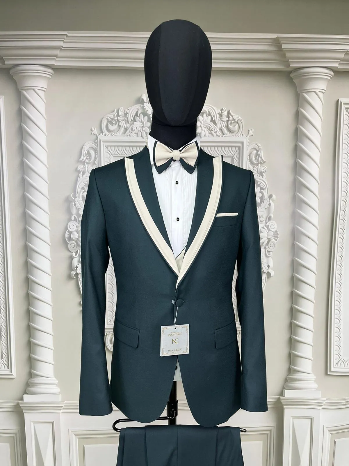 Single Button Three Piece Tuxedo Suit with Contrasting Black Velvet Lapel and Pants.